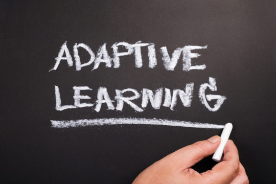 ‘Adaptive Learning’ written on a chalkboard.