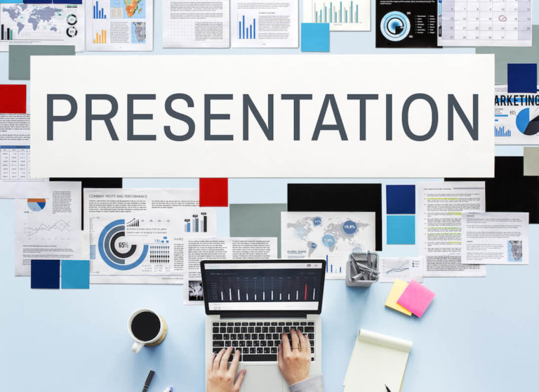 The word ‘presentation’ surrounded by types of presentations and someone typing on a laptop.