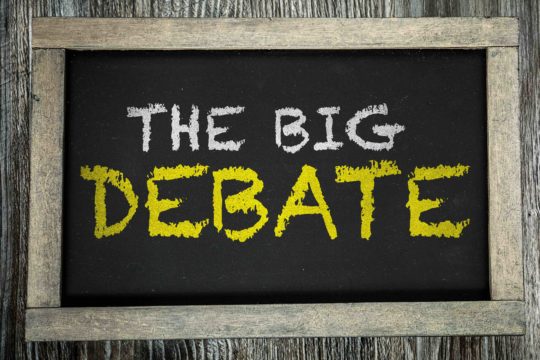 The words “The Big Debate” written on a chalkboard