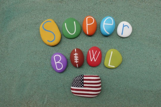 ‘Super Bowl’ spelled out in colorful rocks.