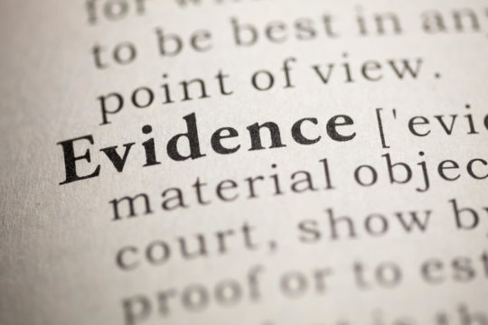 The word and definition of ‘evidence’ in a dictionary.