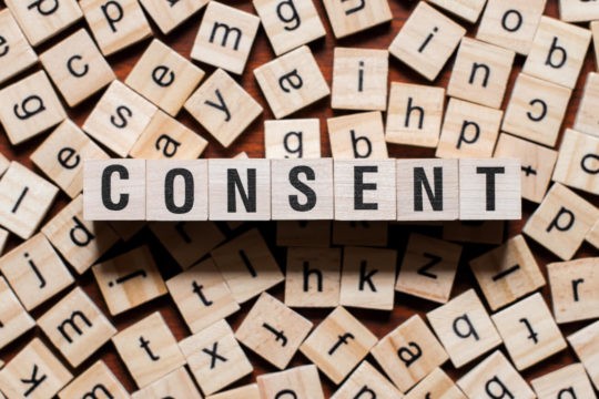 ‘Consent’ spelled out in wooden blocks.
