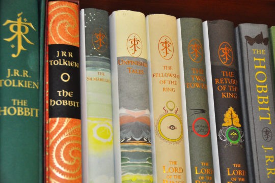 Close up of several Hobbit books on a shelf