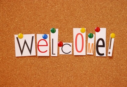 The word welcome spelled out on a bulletin board